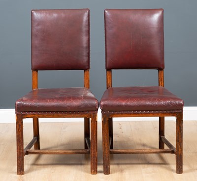 Lot 115 - A pair of red leather dining chairs, the...