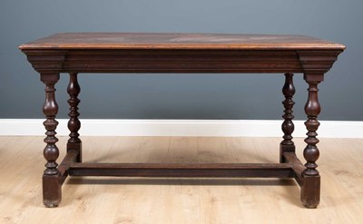 Lot 230 - An antique oak centre table the plank top with...