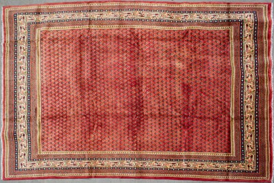 Lot 667 - A Middle Eastern Araak woollen rug with a...