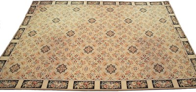 Lot 674 - An English needlework carpet with flowers on a...