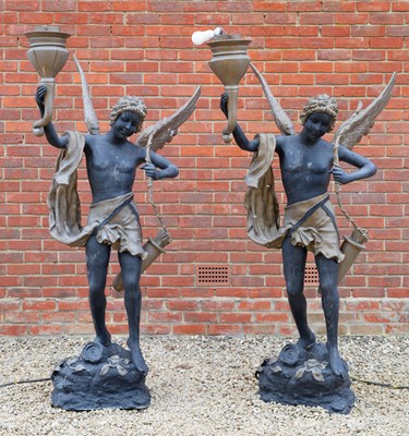 Lot 594 - A pair of black and gold painted bronze...