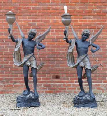 Lot 595 - A pair of black and gold painted bronze...