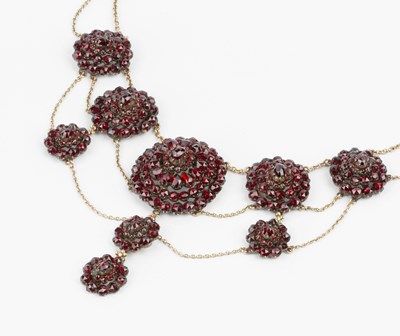 Lot 75 - A 19th century garnet cluster swag necklace,...