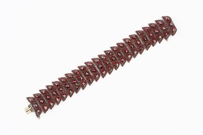 Lot 76 - A 19th century garnet panel bracelet, designed...