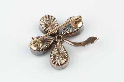 Lot 121 - A diamond and gem set four leaf clover brooch,...