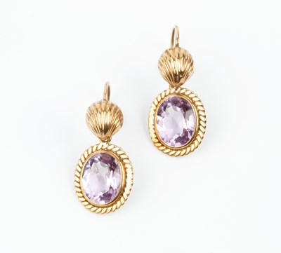 Lot 123 - A pair of amethyst ear pendants, each oval...