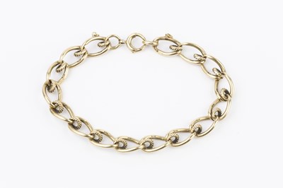 Lot 17 - A 9ct gold fancy curb-link bracelet, with part...