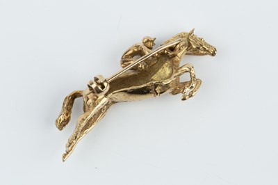 Lot 194 - A 9ct gold horse and jockey brooch by Harriet...