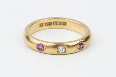 Lot 202 - A ruby and diamond set band ring, the court...