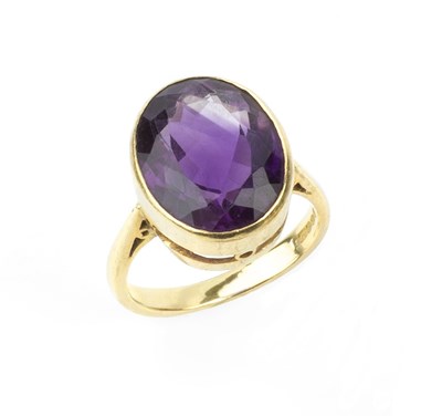 Lot 119 - An amethyst single stone ring, the oval...