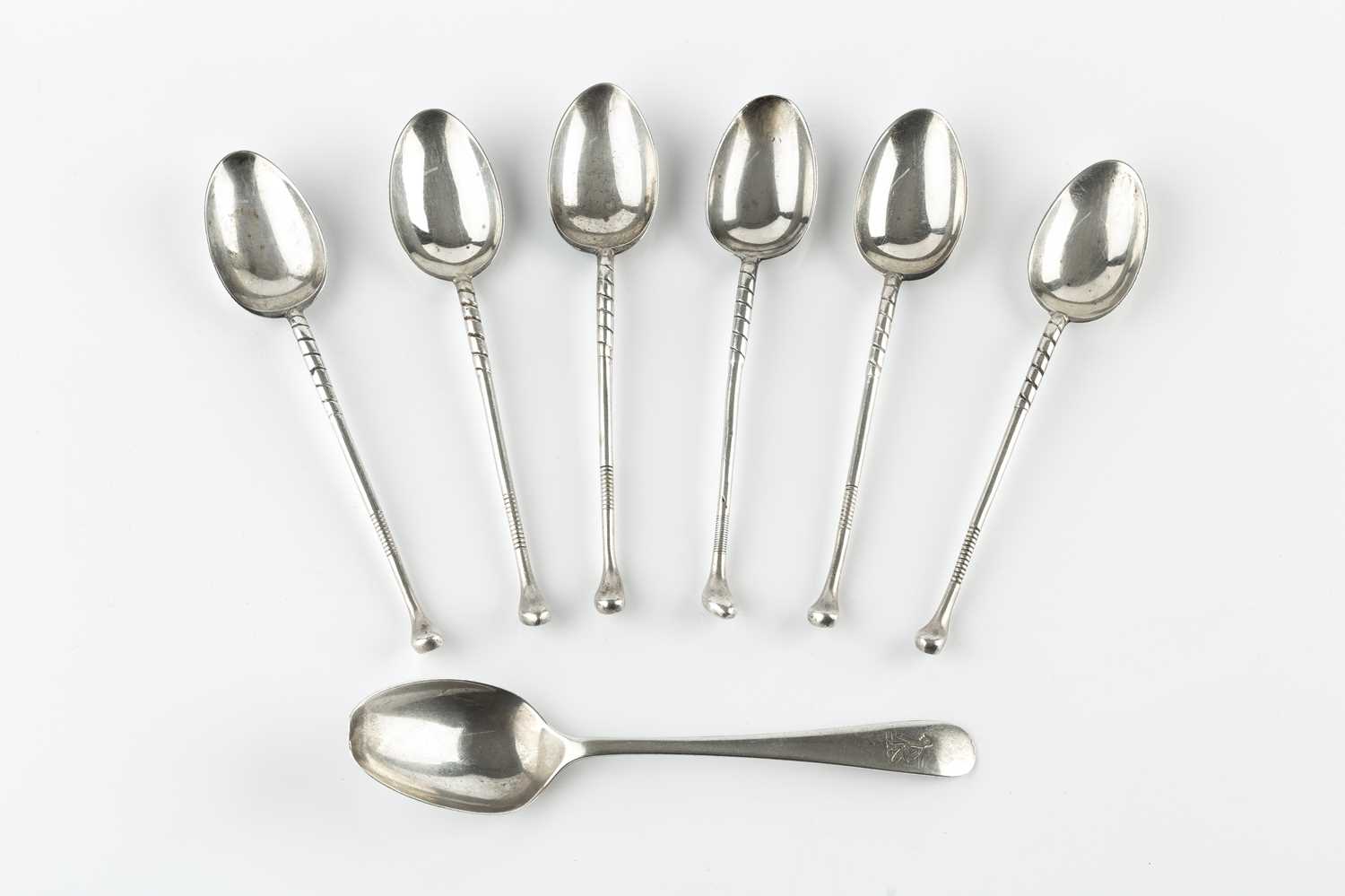 Lot 583 - A set of six silver novelty tea spoons, in the...
