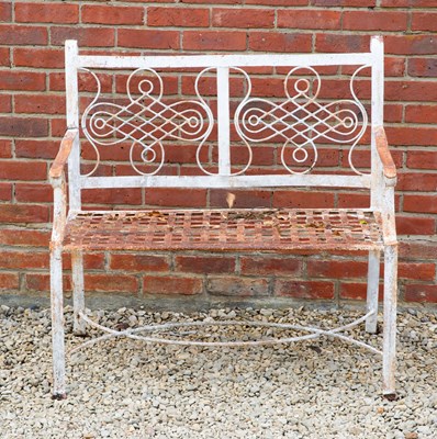 Lot 597 - A white painted cast iron two seater garden...