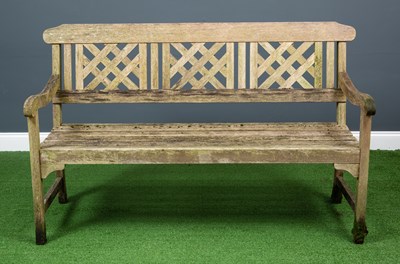 Lot 580a - A modern wooden three seater garden bench, the...