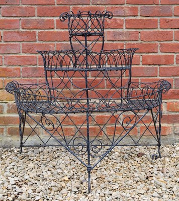 Lot 581a - A black metal painted three tier plant display...