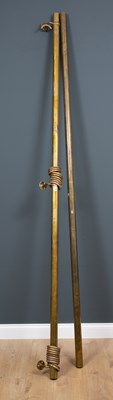 Lot 451 - A pair of brass curtain rails with nineteen...