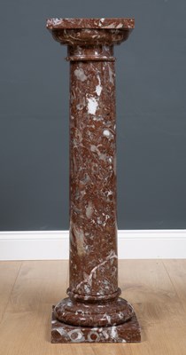 Lot 453 - A brown marble pedestal on a column with...