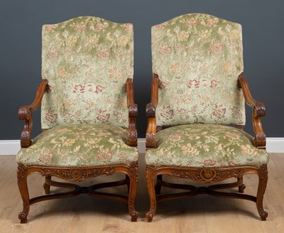 Lot 455 - A pair of carved walnut framed open armchairs...