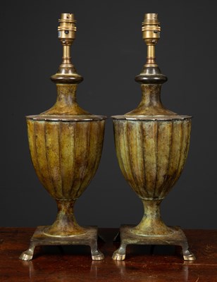 Lot 456 - A pair of bronzed table lamps formed as...