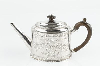 Lot 890 - A George III silver oval tea pot, with beaded...