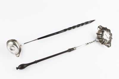 Lot 589 - A George II silver toddy ladle, with shaped...