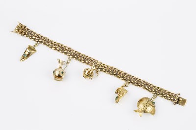 Lot 59 - A charm bracelet, the fancy double row...