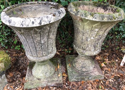 Lot 563a - A pair of cast reconstituted stone garden...