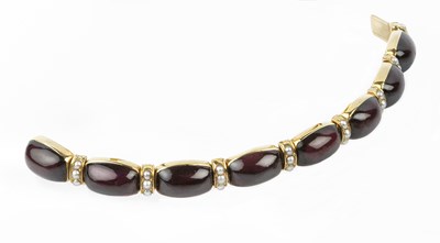 Lot 63 - A garnet and half pearl bracelet, designed as...