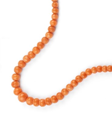 Lot 18 - A coral bead necklace, comprising a single...