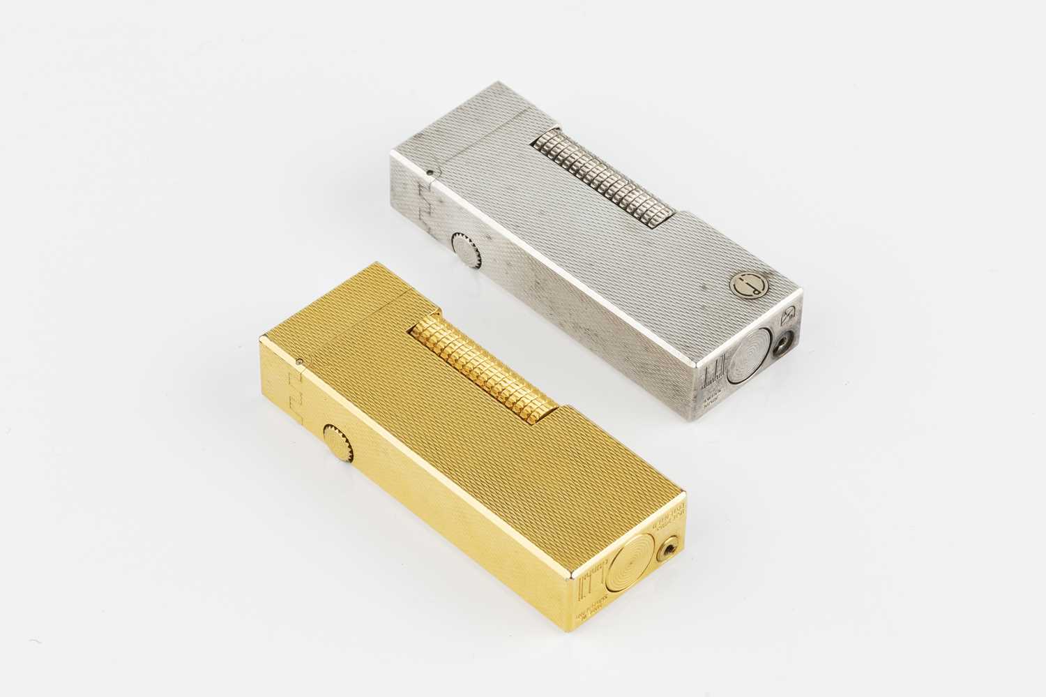 Lot 597 - A gold plated rectangular lighter by Dunhill,...