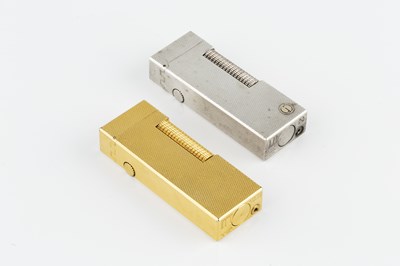 Lot 597 - A gold plated rectangular lighter by Dunhill,...