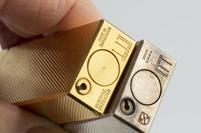 Lot 597 - A gold plated rectangular lighter by Dunhill,...