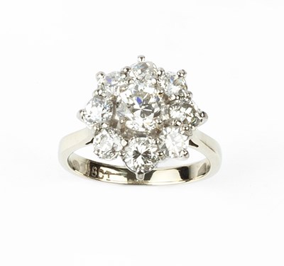 Lot 182 - A diamond cluster ring, the flowerhead cluster...