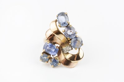 Lot 177 - A sapphire and diamond panel ring, designed as...