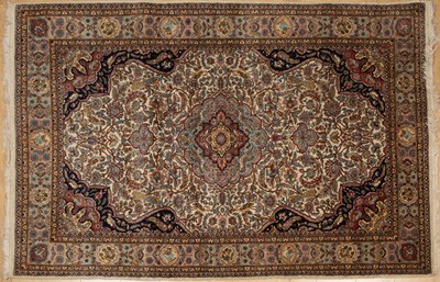 Lot 175 - An Asian white ground rug with floral central...
