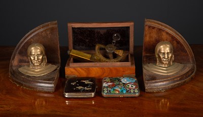 Lot 154 - A pair of bookends with native American head...