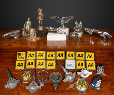 Lot 212 - A collection of car mascots and badges...