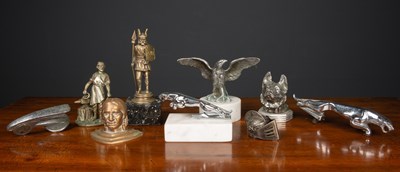 Lot 212 - A collection of car mascots and badges...