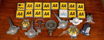 Lot 212 - A collection of car mascots and badges...