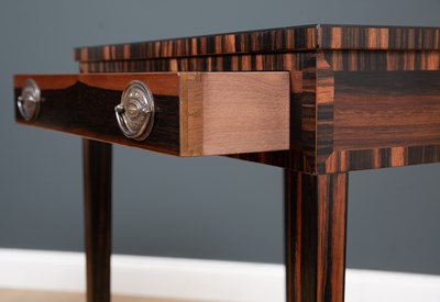 Lot 176 - A pair of coromandel lamp tables with...