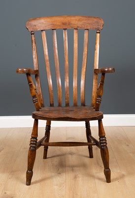 Lot 138 - A late 19th century ash and elm lath back...