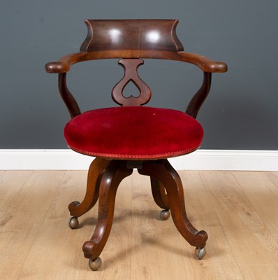 Lot 141 - A Victorian mahogany rotating desk chair with...