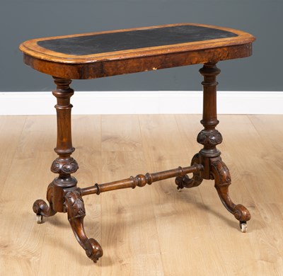 Lot 180 - A Victorian walnut writing table, the leather...