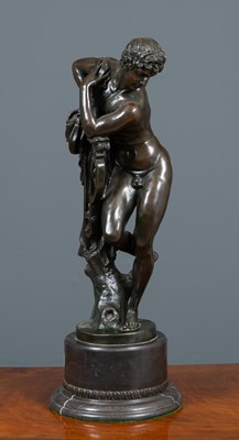 Lot 185 - A bronze sculpture of Apollo leaning on his...