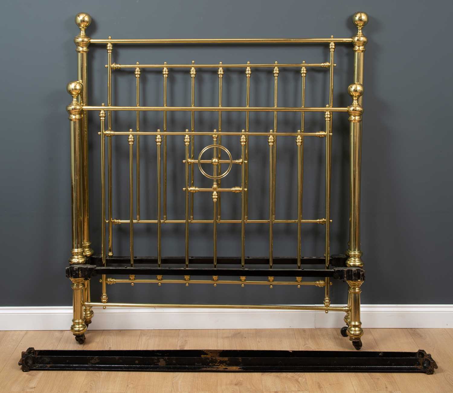 Lot 497 - A Victorian brass double bedstead, with large...