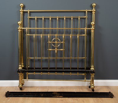 Lot 497 - A Victorian brass double bedstead, with large...