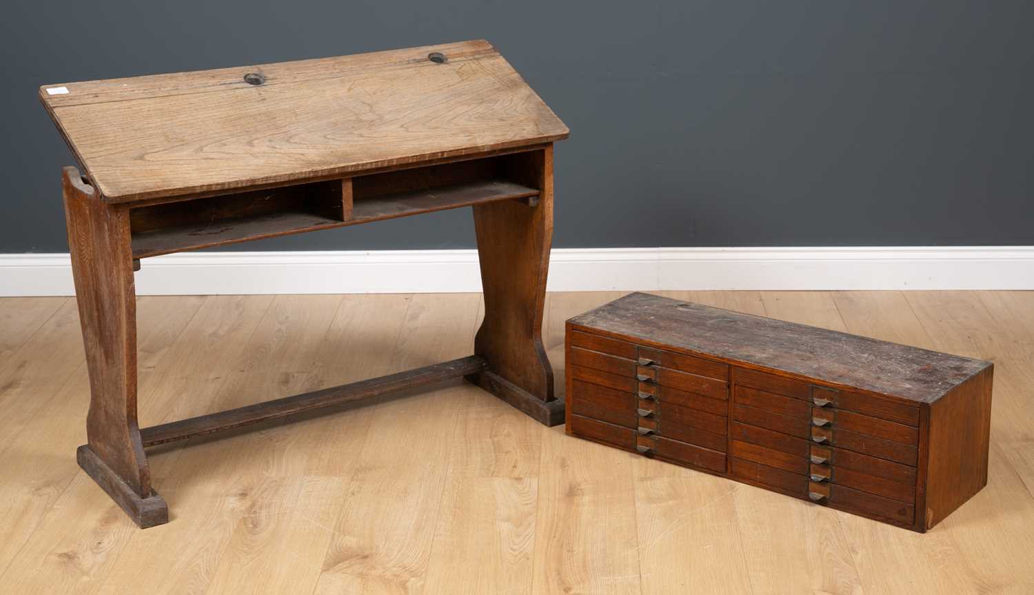 Lot 230 - An antique elm child's school desk, the...