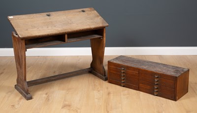Lot 230 - An antique elm child's school desk, the...