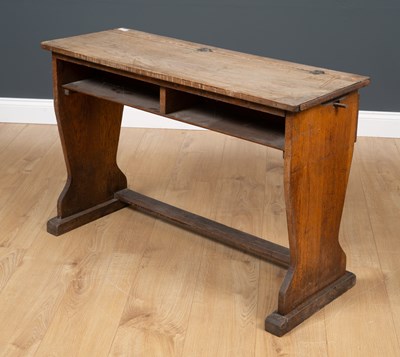 Lot 230 - An antique elm child's school desk, the...