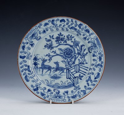 Lot 390 - Delftware plate 18th Century, painted with two...