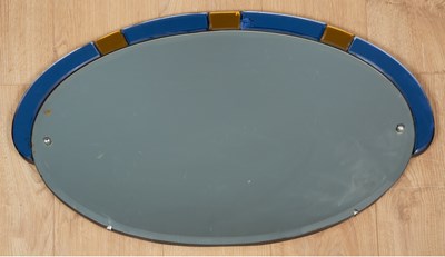 Lot 172 - An art deco oval wall mirror with blue and...